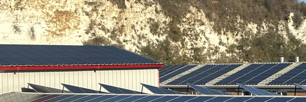 Solar Panels in front of white cliff in Kent to save carbon footprint